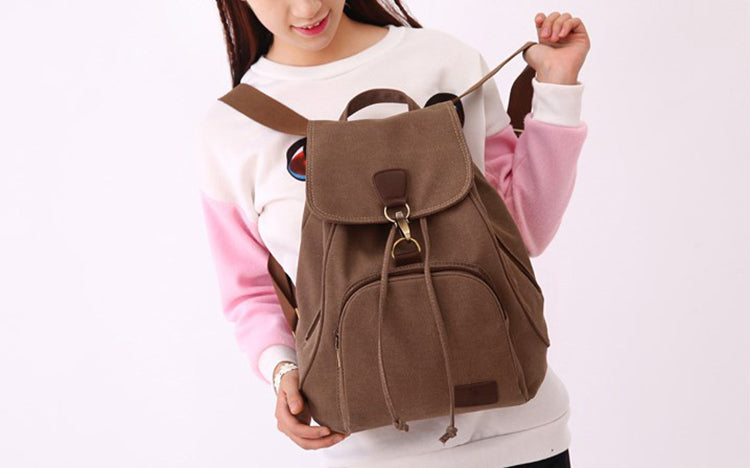 Fashionable women’s canvas bag woman wearing coffee color